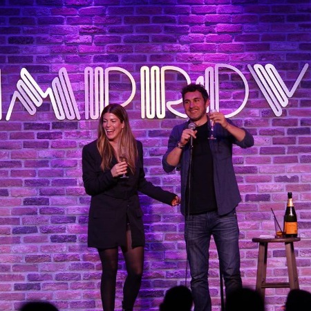 Mae Planert with her spouse Mark Normand during one of the comedy sets.